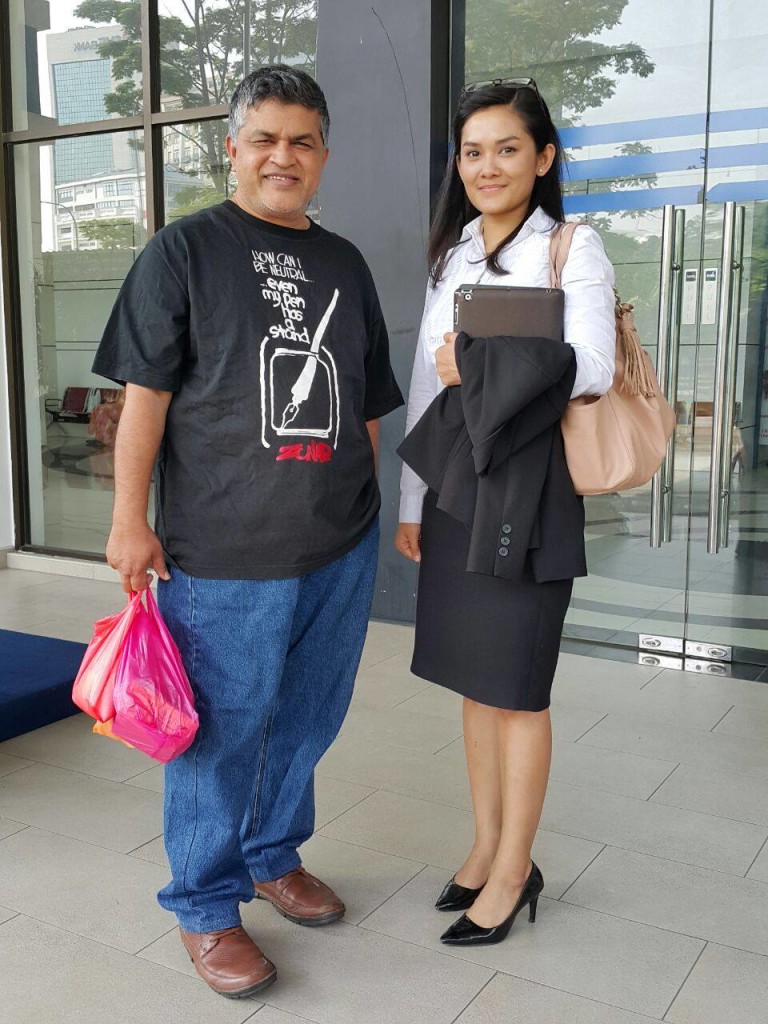 Political cartoonist Zunar, pictured here with attorney Melissa Sasidaran, upon being released on bail from Dang Wangi police lockup yesterday at 10:40 AM Malaysia time.