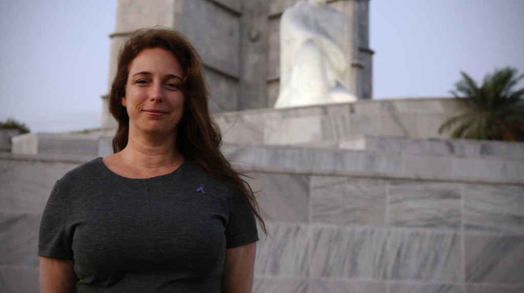 Tania Bruguera is pictured in Havana's Revolution Square, where her performance "Yo Tambien Exijo" (I Also Demand) was cut off by Cuban authorities.  The artwork consisted of an open microphone, and an invitation for Cubans to speak their minds.  On Friday the artist was allowed to flee Cuba, and she is currently in New York (NPR.)